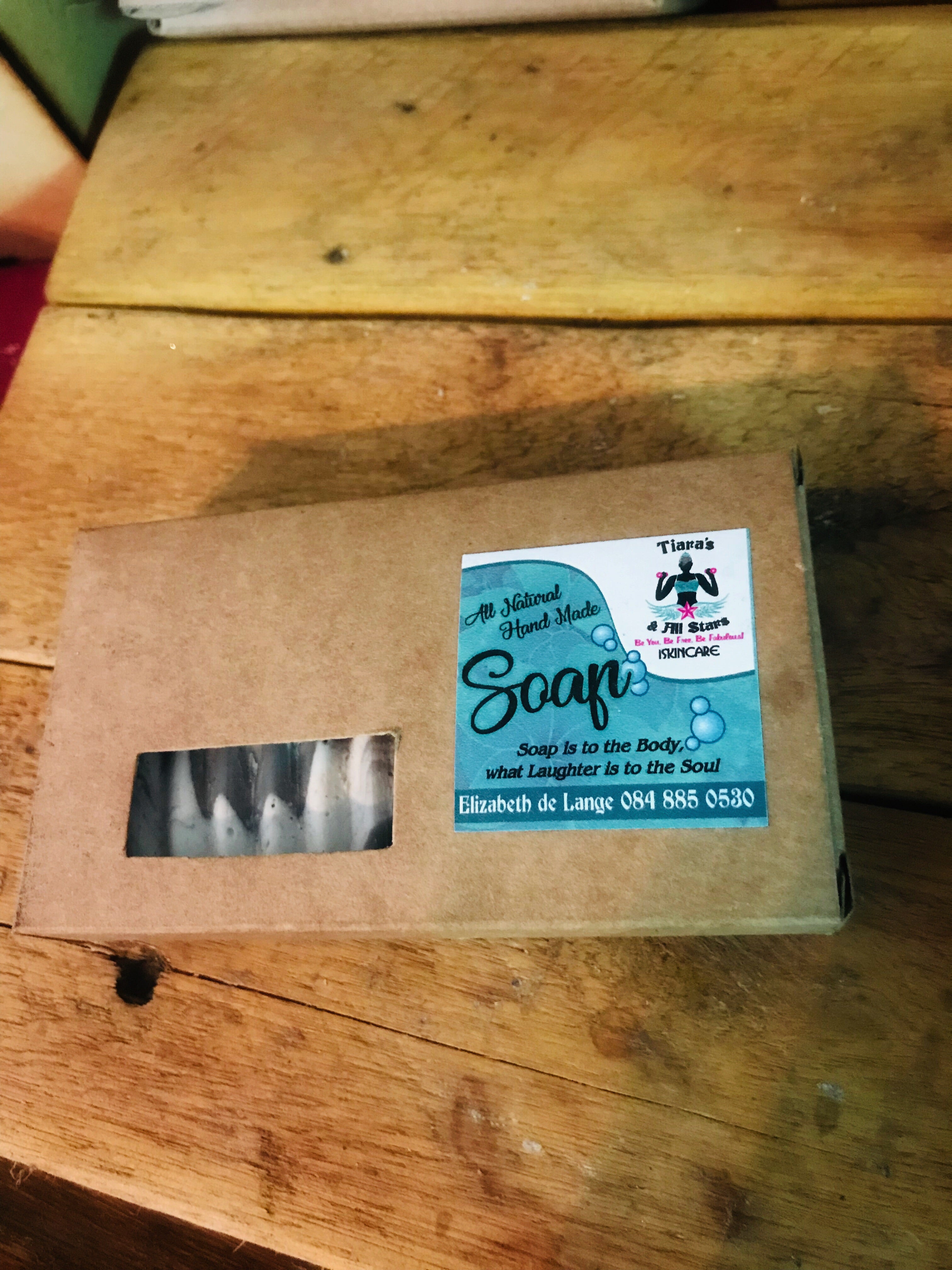 Activated charcoal and geranium soap in a box