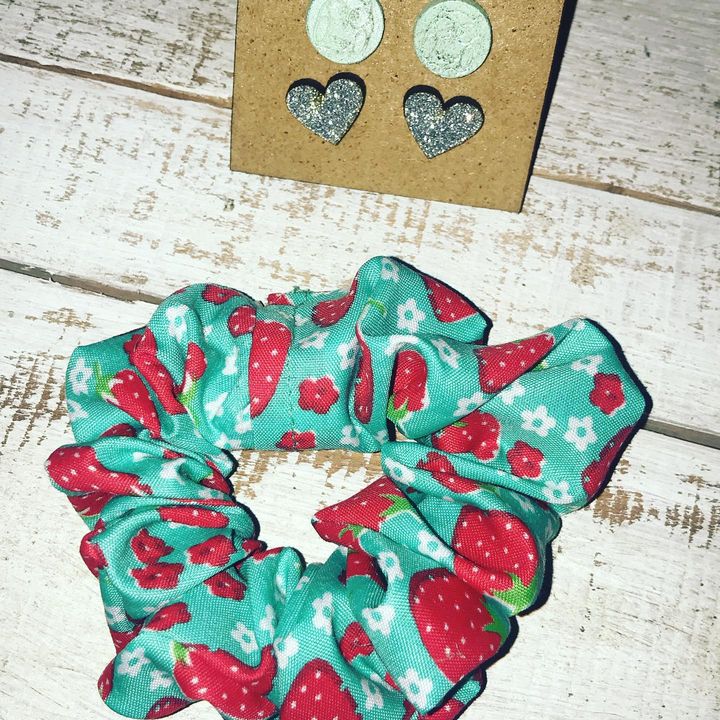 Hair Scrunchie and 2x Pairs Stainless Steel Stud Earrings on a Wooden Board