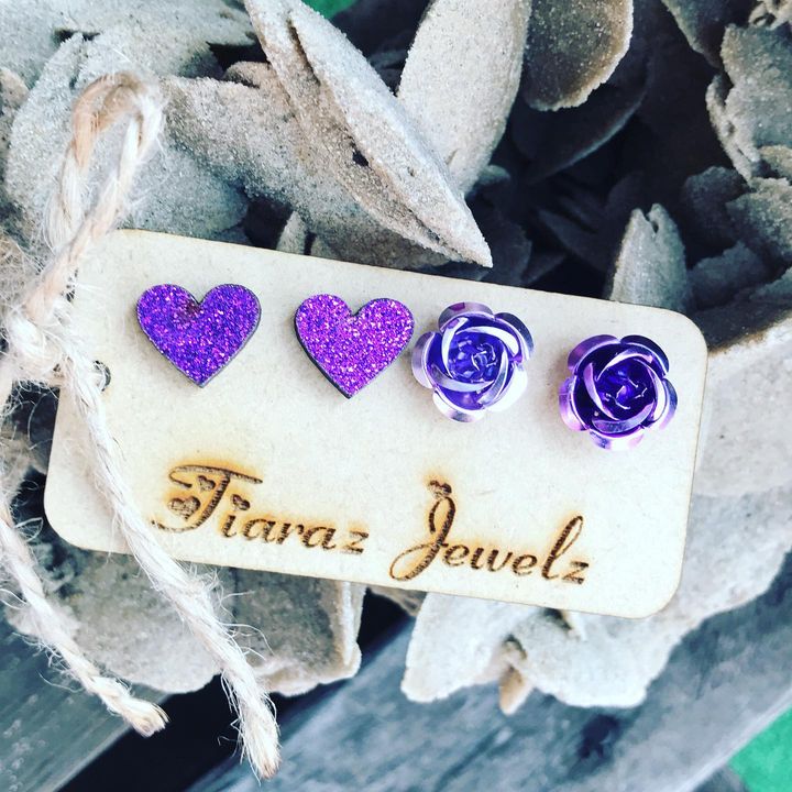 2x Stainless Stud pairs of earrings on a wood board